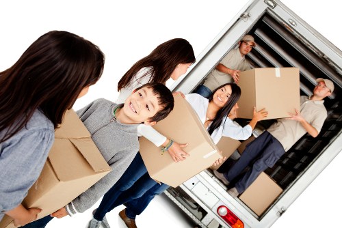 Removal team planning a house move in Chiswick with packed boxes and furniture