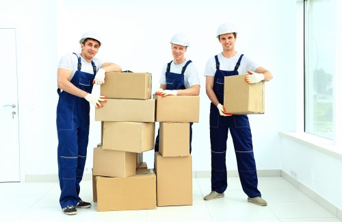 Removal van and moving team working in a Chiswick residential street