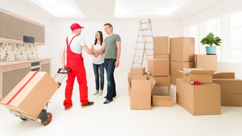 Stacked cartons and protective wrapping for local packing service needs