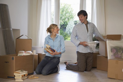Furniture and boxes arranged for delivery after a house removal in Chiswick
