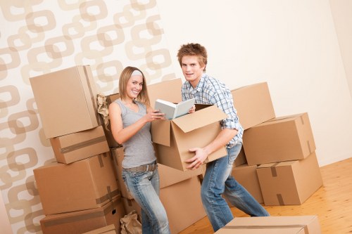 Professional movers handling furniture during a house removal in Chiswick