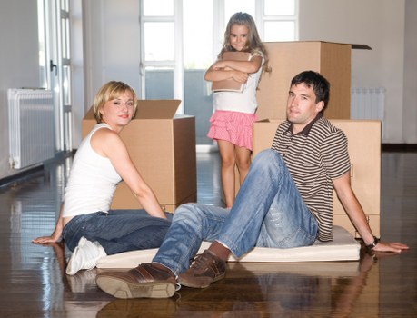 Professional movers handling office equipment during a relocation in Chiswick
